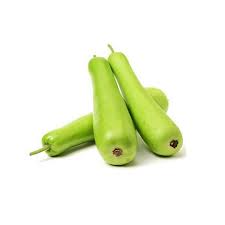 Three green bottle gourds on a white background